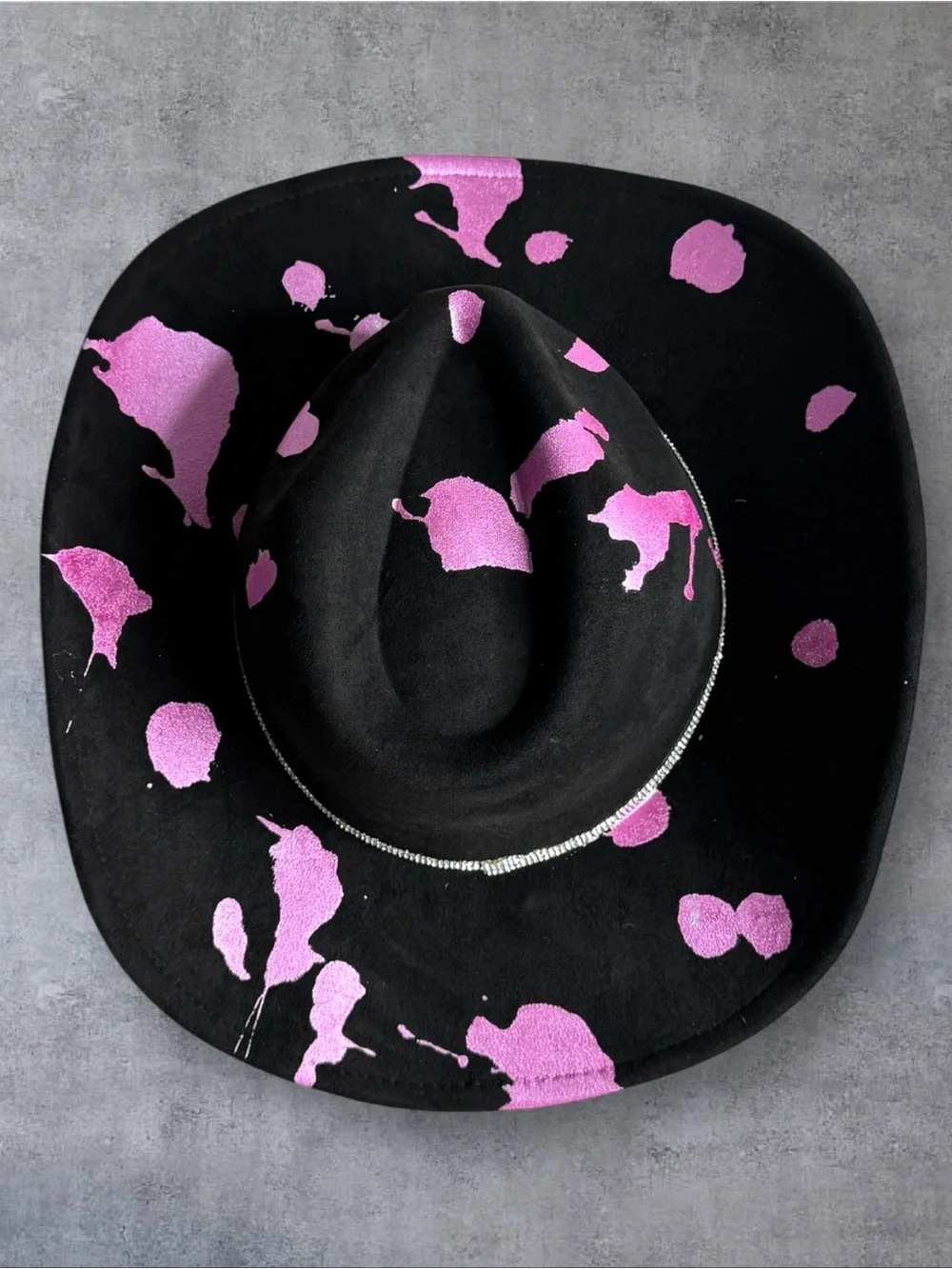 Black Cowboy Hat with Pink Accents and Star Embellishments
